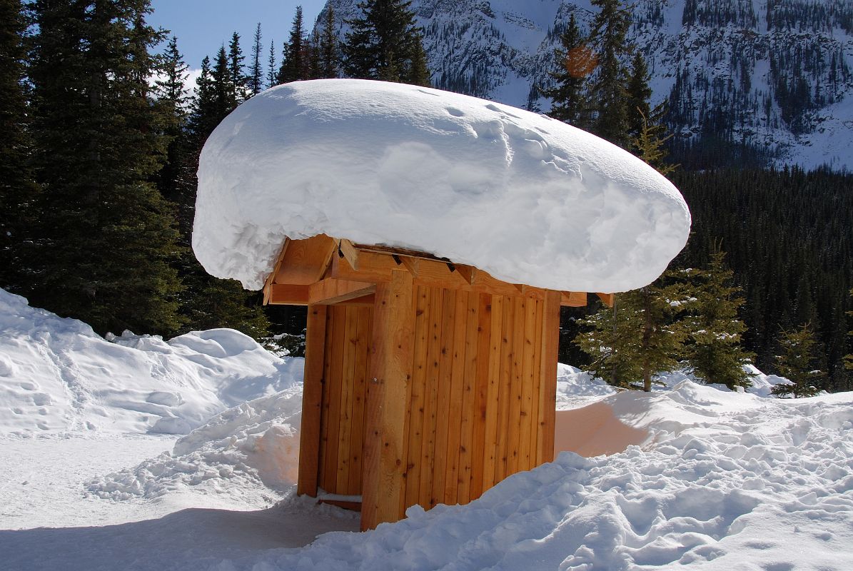 06 Huge Bank Of Snow On Small Building On Walk From Parking Lot To Lake Louise In Winter